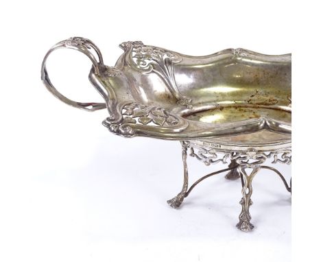 An impressive Edwardian Art Nouveau silver pedestal table centre 2-handled cake basket, pierced heart-shape designs with fold