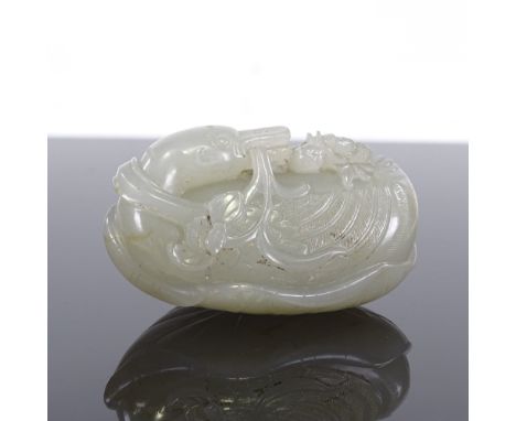 A Chinese celadon jade carving, probably 18th or 19th century, in the form of a Swan and Cygnet on a Lily pad, length 5.5cm.O