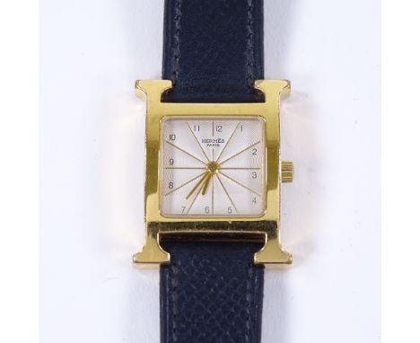 HERMES - a lady's gold plated stainless steel Heure H quartz wristwatch, ref. HH1.201, silvered radiant engine turned dial wi
