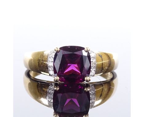 A 9ct gold pink garnet and diamond dress ring, garnet length 8mm, size R, 3.3gVery good original condition, all stones presen