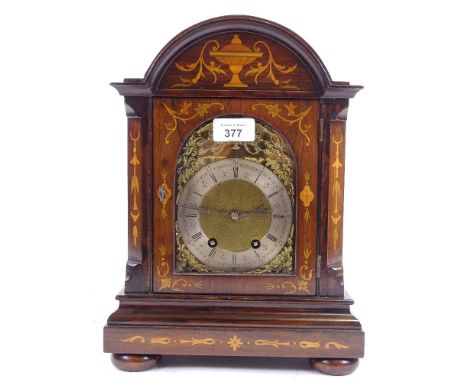 A French 18th century rosewood inlaid dome-top bracket clock, brass cherub and floral dial with Roman numerals hour markers, 