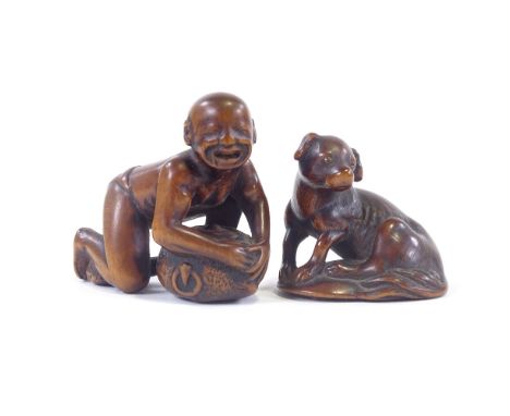 2 hardwood netsuke of a dog and a man with beaver, tallest 4cmOverall good condition, signatures to base 