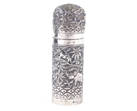 An Indian unmarked silver jar and cover, relief embossed animal and village decoration, height 11.5cm, 2.1ozGood original con