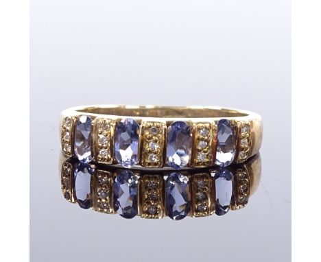 A 9ct gold tanzanite and diamond half hoop ring, setting height 5.1mm, size R, 3g Very good original condition, all stones pr