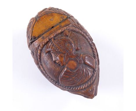 An early 19th century coquilla nut snuff box, carved classical figure on lid and woman on base with animal face to hinge end,