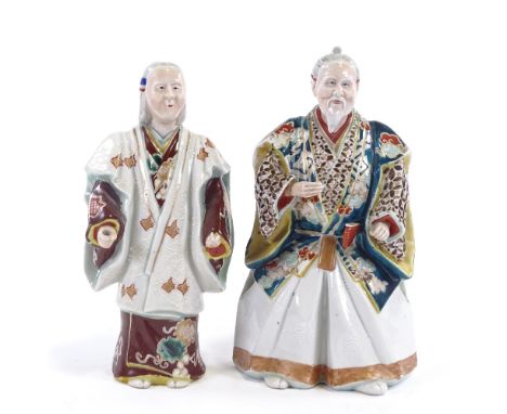 2 Japanese Meiji period polychrome porcelain figures, of actors wearing noh masks, tallest 23cm.Both missing original item be