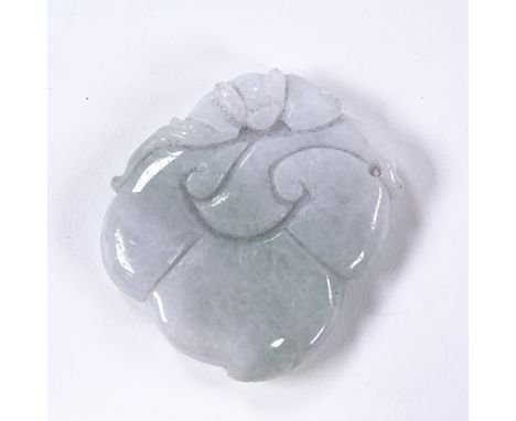 A Chinese relief carved jade pendant, 4.5cm across 