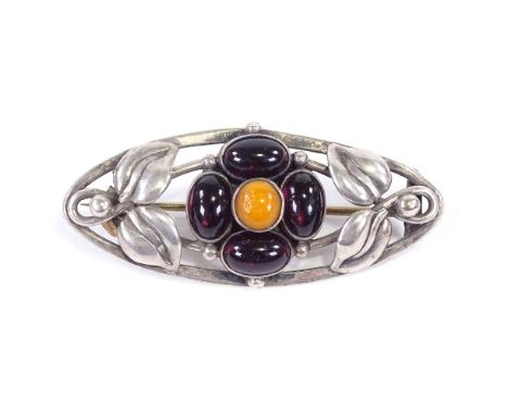 PETER CHRISTIAN JENSEN - an Art Nouveau Danish silver amber and amethyst cabochon brooch, floral decoration, maker's marks Ch