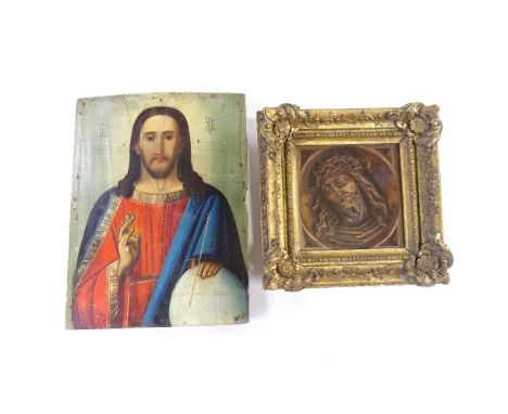 A 19th/20th century painted Russian icon on wood panel, together with a wood carved Christ in gilt frame, largest 30cm x 22cm