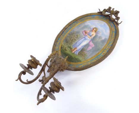 An Ormolu twin branch wall sconce, with hand painted porcelain panel of a fairy and Bacchanalian mount, length 40cm.Overall g