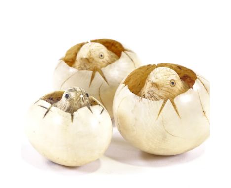 3 Japanese ivory hatching chicks in egg, smallest is a netsuke with signature to base, largest 5cm long.All in good condition