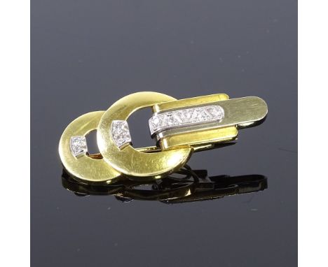 An Art Deco style 18ct yellow and white gold diamond dress clip brooch, pierced and stepped diamond set settings, with hinged