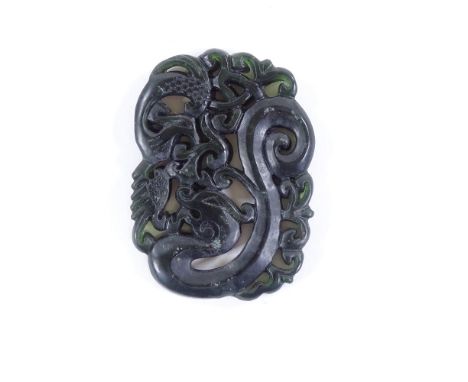 A Chinese relief carved and jade pendant, length 5cm 