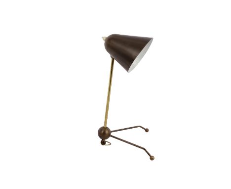 OTTO KOLB (SWISS 1912-1996): A brass desk lamp, circa 1950s, the conical laquered brass shade, over a tubular brass stem, rai
