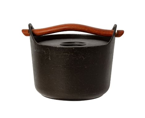 TIMO SARPANEVA (FINNISH 1926-2006) FOR ROSENLEW & CO: A cast iron casserole dish and cover with removable wooden handle, desi
