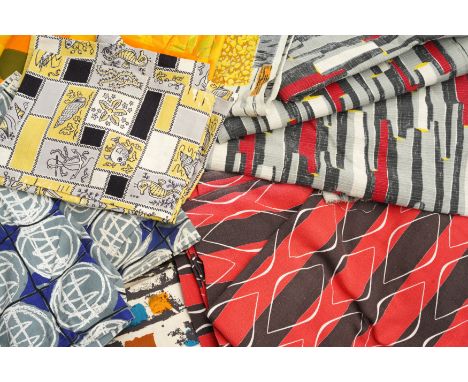 A GROUP OF MID-CENTURY FABRICS, graphic prints, in various colourways, mostly un-cut fabrics, some sewn into curtains panels,