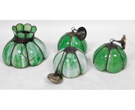 A group of green opalescent ceiling lighting, comprising one large shade, 48cm wide, and three smaller shades, 38cm wide. 