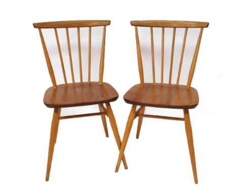 A pair of Ercol light elm kitchen chairs, each with a slatted back, solid seat, and tapering cylindrical legs, 78cm high.