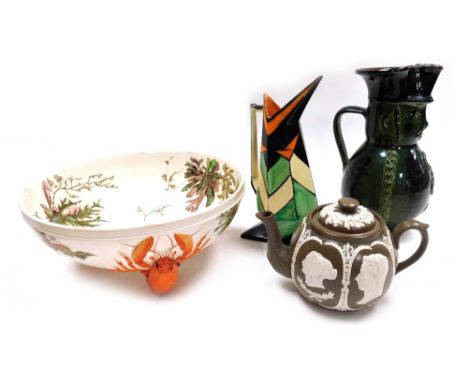 A group of pottery , comprising a Hungarian terracotta green glazed character jug, 24cm high, a Myott Son &amp; Co pottery ju