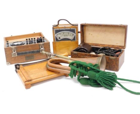 A Pifco vibrator, boxed, Ediswan volt meter, number 68105, an amp meter, cased, table guillotine, and a bugle. (5)