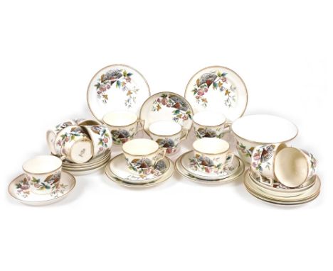 A late 19thC porcelain part tea service, decorated in the Indiana pattern, comprising slop or sugar bowl, twelve tea cups, te