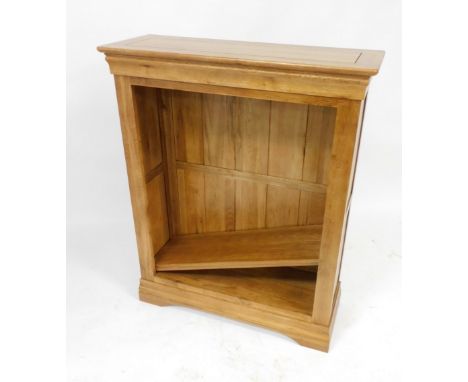 A light oak open bookcase, of three shelves, raised on a bracket plinth base, 110cm high, 89cm wide, 33cm deep.