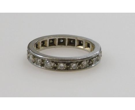 A diamond full eternity band, set in white metal, size K, 4.1g. 