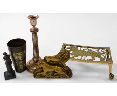 A brass kettle stand, pierced and engraved with a tiger, cast brass of a lion and a lioness, silver plated candlestick, cast 