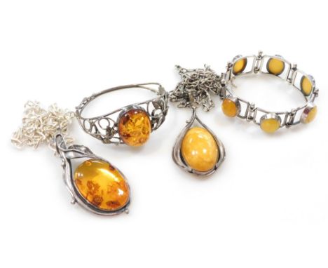 Silver and amber jewellery, comprising two pendants on chains, a bangle, and a six link bracelet on a snap clasp with safety 