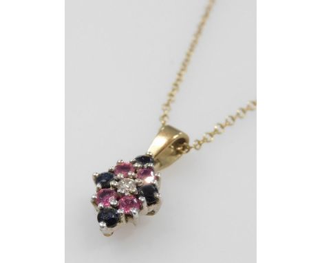 A 9ct gold diamond, ruby and sapphire pendant, in a diamond shaped design, on a belcher link neck chain, stamped 9ct, 2.5g. 