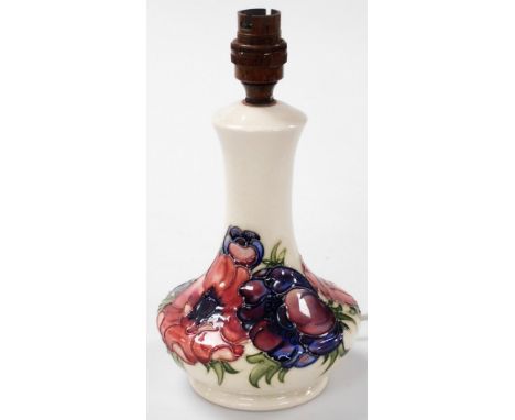 A Moorcroft Anemone pattern pottery table lamp, against a white ground, impressed marks, 26.5cm high.