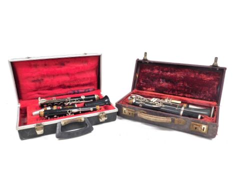 A Boosey and Hawkes Regent clarinet, together with a Selmer Studente Console clarinet, both cased. (2) 