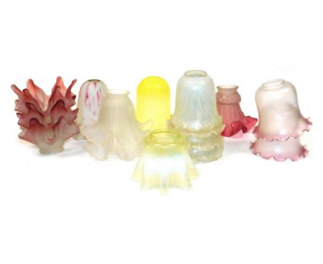 A group of frosted and other glass light shades, to include a graduated yellow glass example, 15cm high, a vaseline glass sha