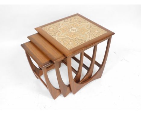 A G Plan teak nest of occasional tables, the largest table with a four tile top, 51cm high, 50cm wide, 51cm deep.