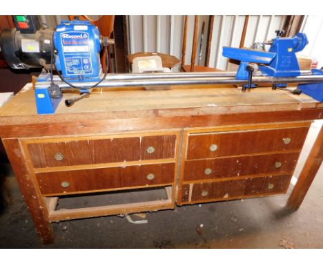 A Record spindle lathe CL23 36X18, mounted on a wooden bench, base with various drawers, 177cm wide.