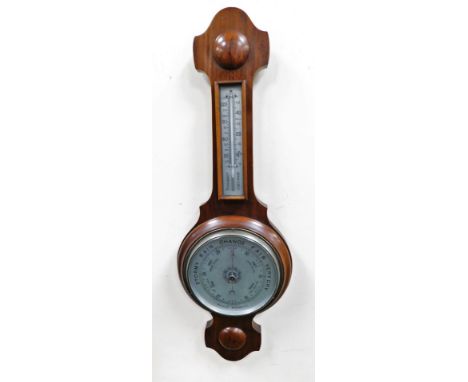 An early 20thC walnut cased aneroid barometer, with thermometer, 66.5cm high.
