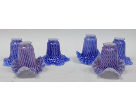 A group of moulded glass light shades, each in a pink and blue repeating pattern. (1 tray)