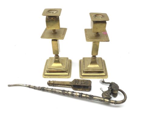 Pair Victorian brass candlesticks, pair William Shakespeare cast nutcrackers and an Indian white metal pipe (3) Condition Rep