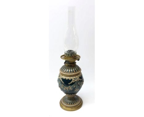 Victorian style oil lamp, ceramic base relief moulded with ribbons and foliage with brass mounts and fittings, H58cm overall 