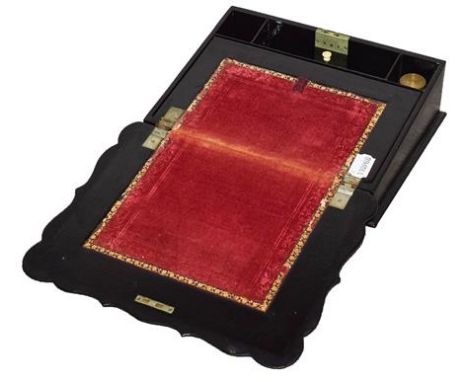 A Victorian Papier-Mâché Writing Slope, the cartouche shaped hinged top with mother-of-pearl inlay painted and gilt foliate d