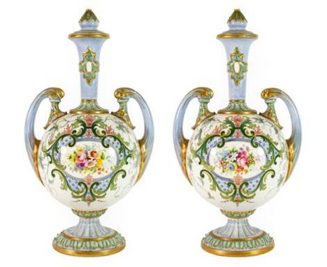 A Pair of Royal Worcester Porcelain Vases and Covers, 1902, of ovoid form with tall trumpet necks and scroll handles, painted