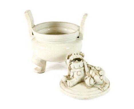 A Blanc de Chine Censer and Cover, Qing Dynasty, probably 18th century, with dog of fo finial, on tripod base, 19cm high.  La