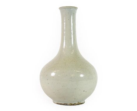 A Korean Porcelain Bottle Vase, Choson Dynasty, undecorated, 28.5cm high; and An Arita Porcelain Flask, painted in underglaze