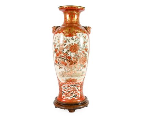 A Kutani Porcelain Vase, circa 1900, of baluster form with birds' mask handles, typically painted in orange and gilt with bir