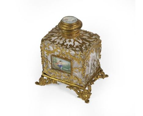 A French Brass-Mounted Clear Glass Scent-Bottle, oblong, with openwork brass mounts, the front applied with a portrait of gen