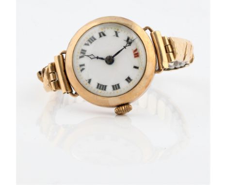 A hallmarked 9ct yellow gold cased ladies cocktail watch, the white enamel dial having hourly Roman numerals, on expanding br