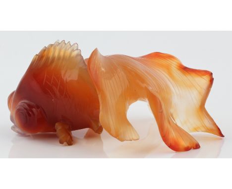 An orange jade fantail fish figure, approx. length 8cm. IMPORTANT: Viewing is available for this lot - please book a slot via