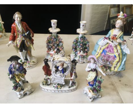 Five Meissen style figures and figure groups, lady in litter, male and female with grapes, etc, with pair of candlestick hold