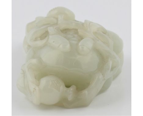 A pale green jade frog figure with fruit and leaves on top, approx. length 8cm. IMPORTANT: Viewing is available for this lot 
