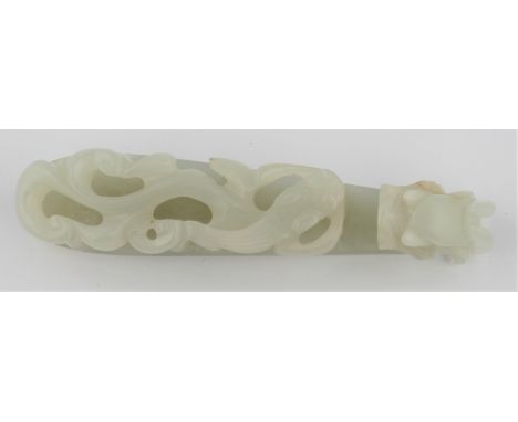 A pale green jade belt hook with dragon and dragon child, approx. length 8cm. IMPORTANT: Viewing is available for this lot - 